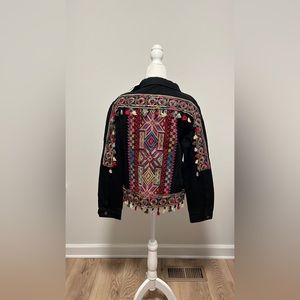 Black denim jacket with colorful embroidery and tassels